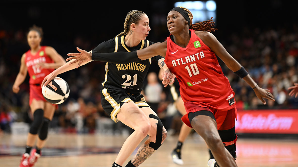 Atlanta Dream guard Rhyne Howard (10) reaches for the ball in front of Washington Mystics forward Emily Engstler (21) during the fourth quarter at CareFirst Arena.
