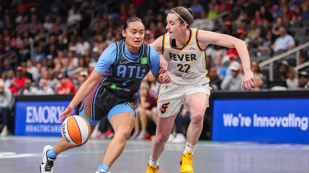 Atlanta Dream guard Te-Hina Paopao (2) drives on Indiana Fever guard Caitlin Clark (22) in the first half at State Farm Arena.