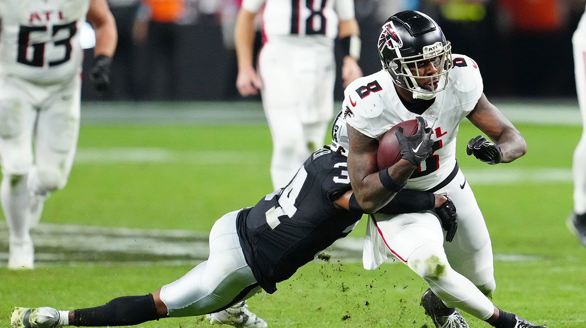 Atlanta Falcons tight end Kyle Pitts (8) is tackled by Las Vegas Raiders safety Thomas Harper (34) during the fourth quarter at Allegiant Stadium.