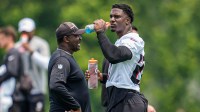 Atlanta Falcons linebacker James Pearce Jr. (27) takes a drink on the field during Minicamp practice at Children's Healthcare of Atlanta Training Ground.