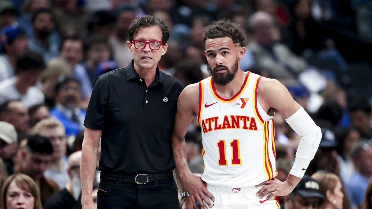Atlanta Hawks head coach Quin Snyder speaks with Atlanta Hawks guard Trae Young (11) during the first half against the Dallas Mavericks at American Airlines Center.