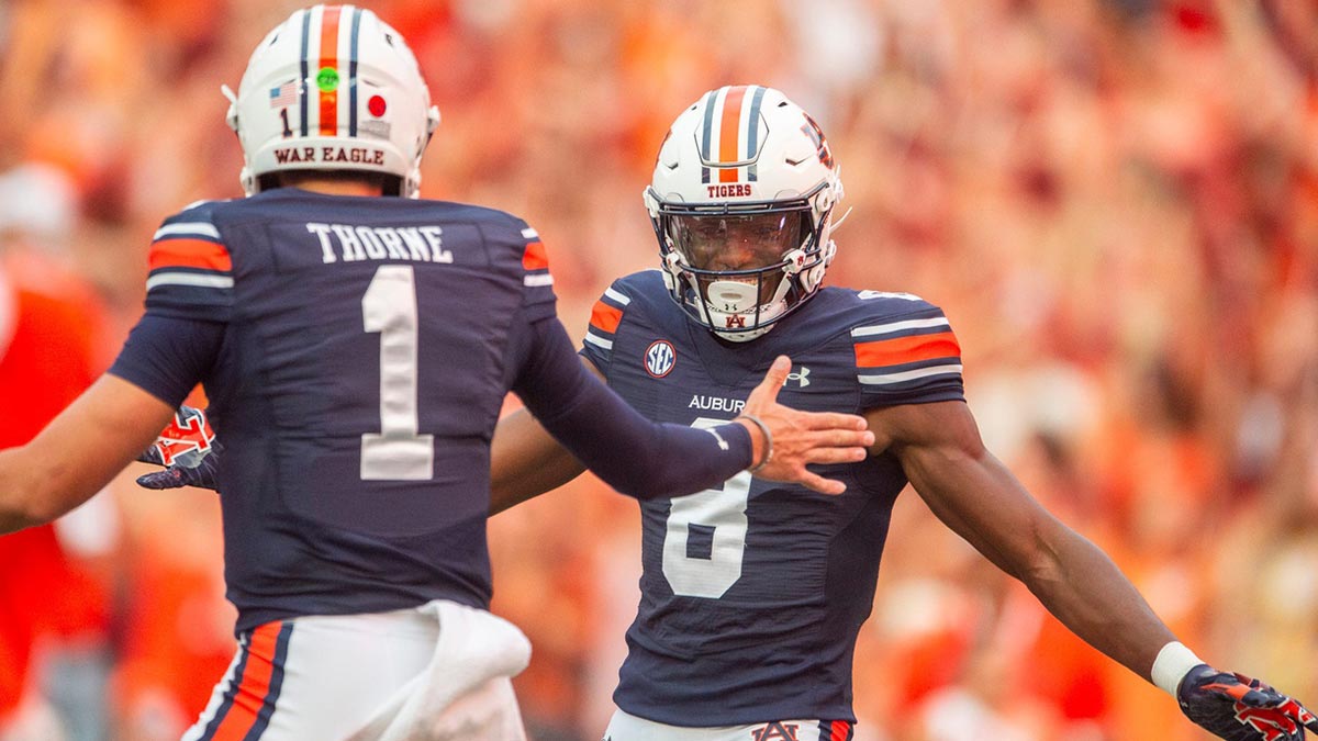 Auburn Tigers quarterback Payton Thorne (1) and Cam Coleman (8) celebrate their touchdown connection as Auburn Tigers takes on Alabama A&M Bulldogs at Jordan-Hare Stadium in Auburn, Ala., on Saturday, Aug. 31, 2024. Auburn Tigers lead Alabama A&M Bulldogs 52-3 at halftime.