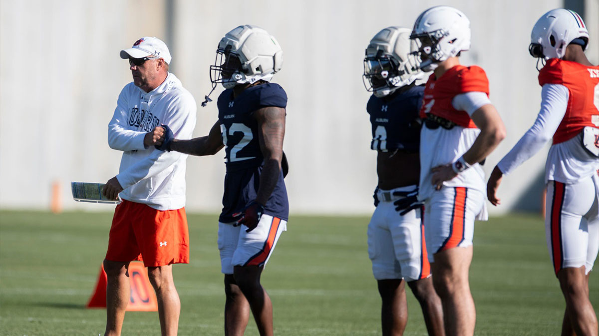 Auburn Tigers head coach Hugh Freeze shakes hands with running back Alvin Henderson (22) during football practice at Woltosz Football Performance Center in Auburn, Ala., on Thursday, April 10, 2025.