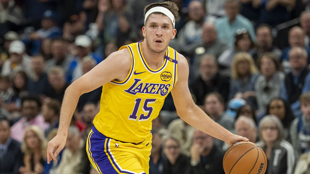 Los Angeles Lakers guard Austin Reaves (15) dribbles the ball against the Minnesota Timberwolves during game three of first round for the 2024 NBA Playoffs at Target Center.