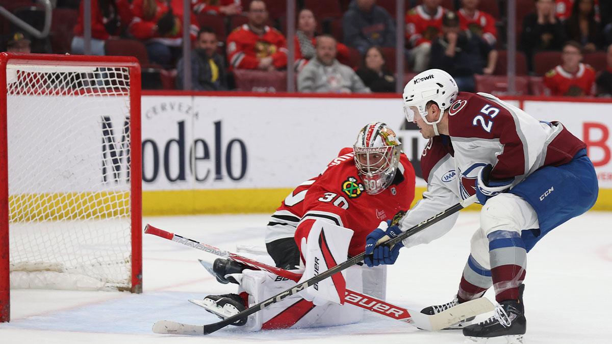 Colorado Avalanche right wing Logan O'Connor (25) takes a shot on goal against Chicago Blackhawks goaltender Spencer Knight (30) during the third period at United Center