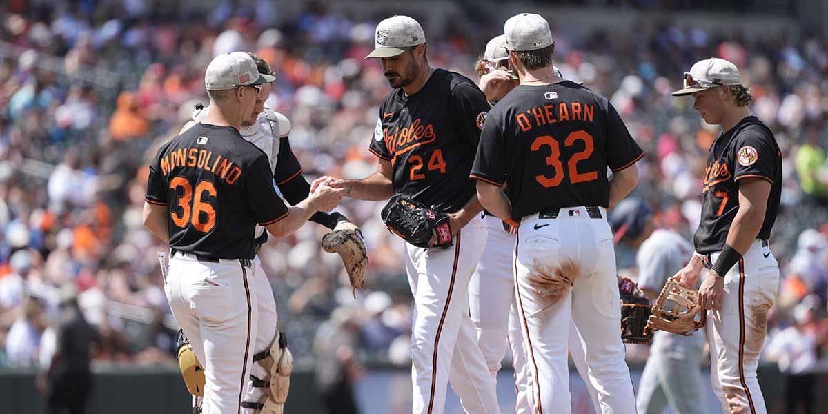 Baltimore Orioles interim manager Tony Mansolino (36) makes a pitching change taking Baltimore Orioles pitcher Zach Eflin (24) out of the game during the sixth inning against the Washington Nationals at Oriole Park at Camden Yards.