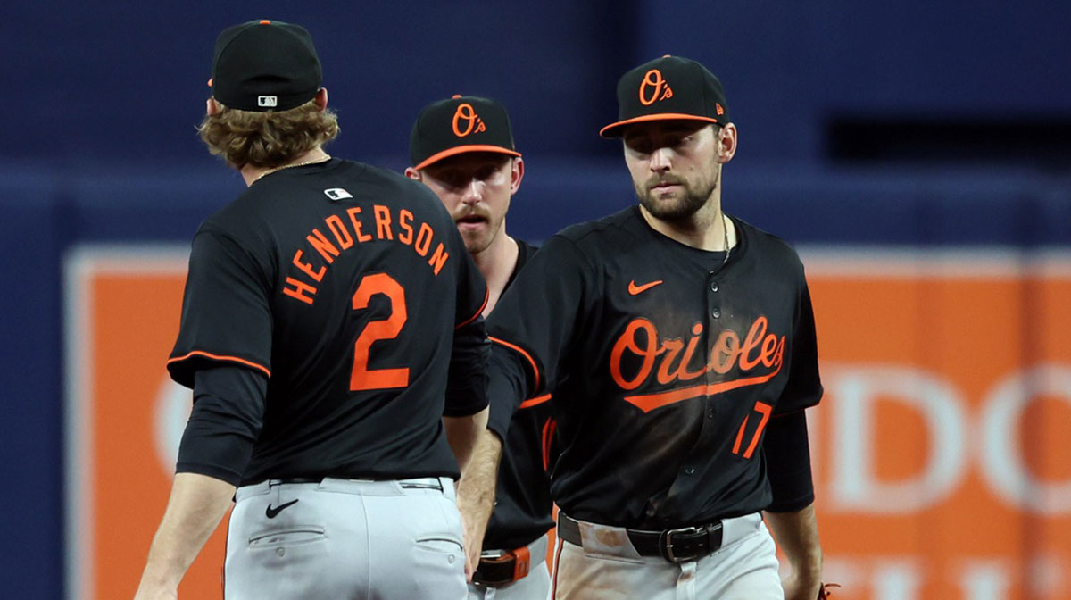 Baltimore Orioles shortstop Gunnar Henderson (2), outfielder Colton Cowser (17) and third base Jordan Westburg (11) celebrate after they beat the Tampa Bay Rays at Tropicana Field. Adley Rutschman Ryan Mountcastle