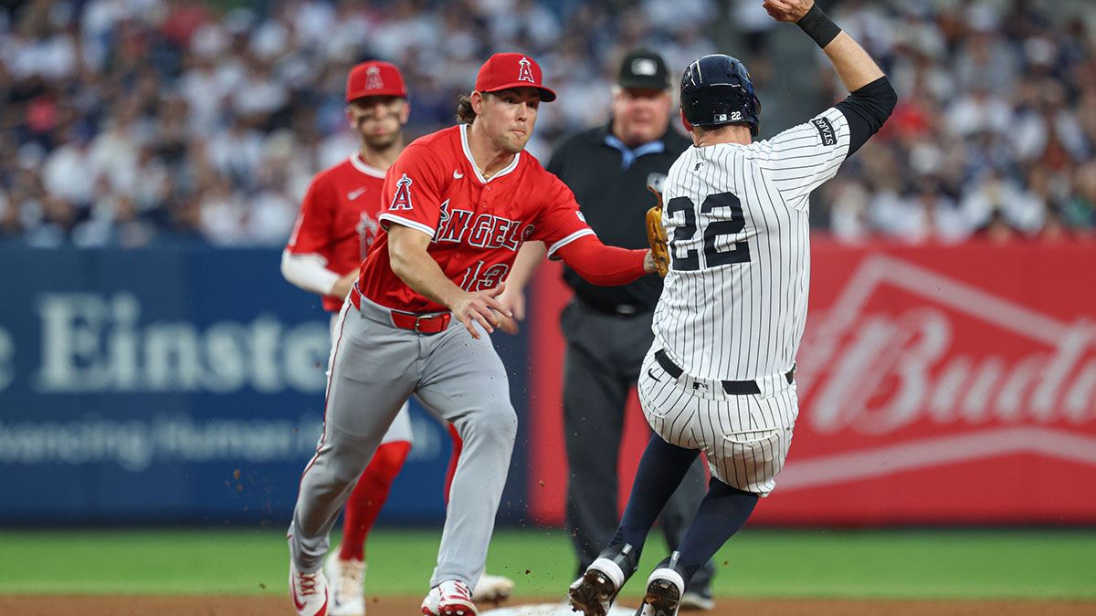New York Yankees catcher Ben Rice (22) is tagged out by Los Angeles Angels second baseman Scott Kingery (13) during the second inning at Yankee Stadium.