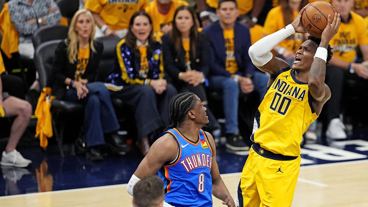 Indiana Pacers guard Bennedict Mathurin (00) shoots the ball against Oklahoma City Thunder forward Jalen Williams (8) during the fourth quarter in game three of the 2025 NBA Finals at Gainbridge Fieldhouse