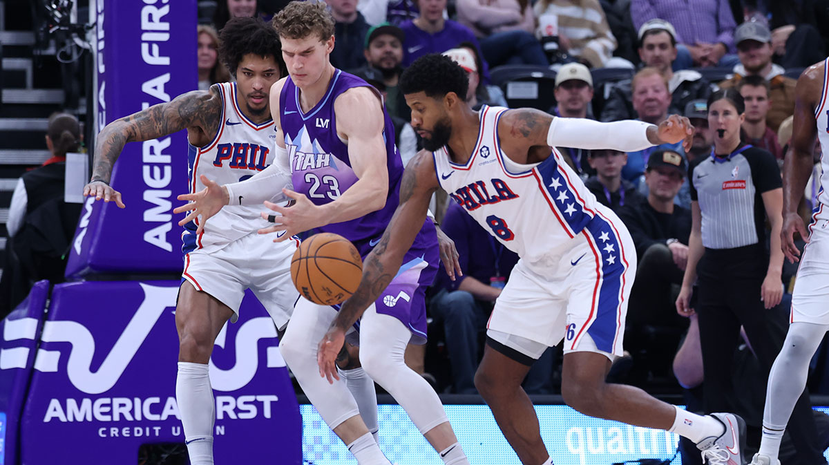 Philadelphia 76ers forward Paul George (8) steals the ball from Utah Jazz forward Lauri Markkanen (23) during the second quarter at Delta Center.