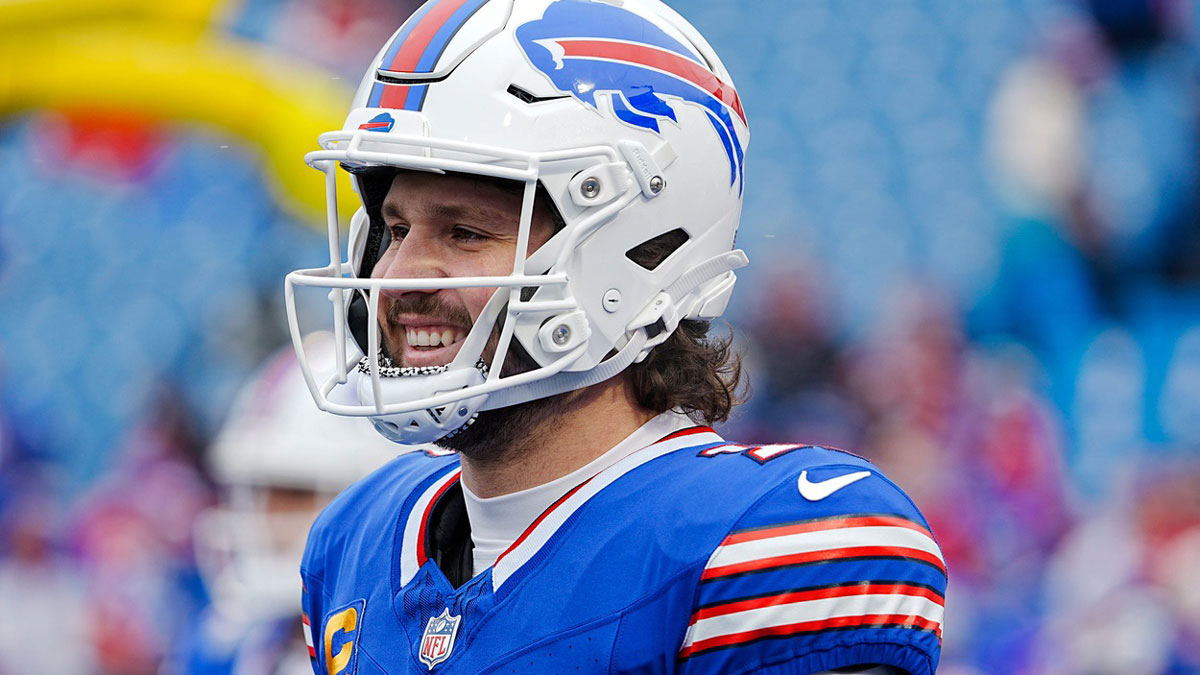 Buffalo Bills quarterback Josh Allen (17) smiles while warming up before the Buffalo Bills wild card game against the Denver Broncos at Highmark Stadium