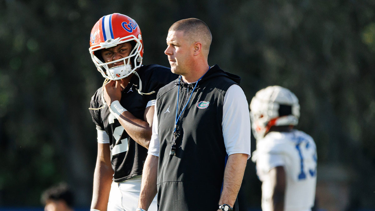 Florida Gators quarterback DJ Lagway (2) and Florida Gators head coach Billy Napier watch during spring football practice at Heavener Football Complex at the University of Florida in Gainesville, FL on Thursday, March 6, 2025.