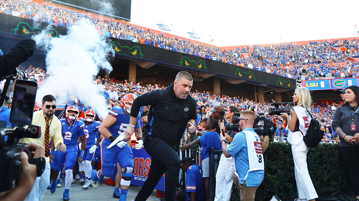 Florida Gators head coach Billy Napier leads the team out of the tunnel prior to the game against the LSU Tigers at Ben Hill Griffin Stadium.