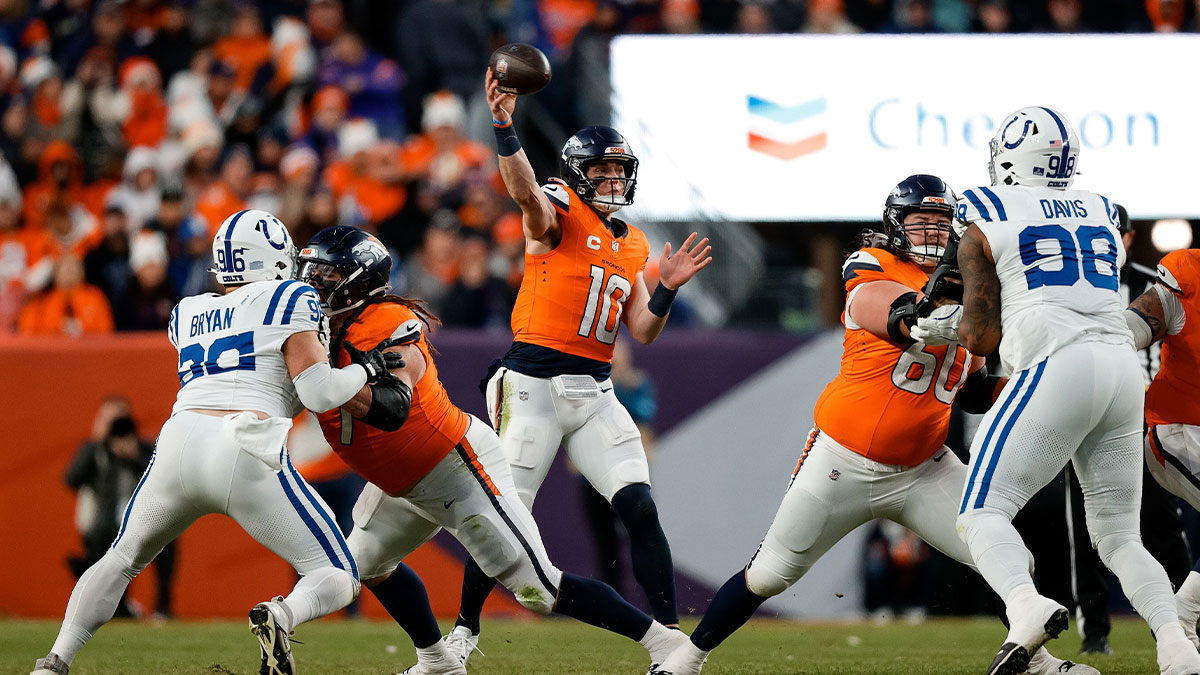 Dec 15, 2024; Denver, Colorado, USA; Denver Broncos quarterback Bo Nix (10) attempts a pass as guard Quinn Meinerz (77) defends against Indianapolis Colts defensive tackle Taven Bryan (96) and center Luke Wattenberg (60) defends against defensive tackle Raekwon Davis (98) in the third quarter at Empower Field at Mile High. Mandatory Credit: Isaiah J. Downing-Imagn Images