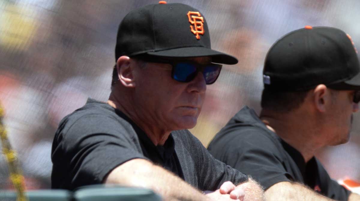 San Francisco Giants manager Bob Melvin (left) watches his team take on the Boston Red Sox.