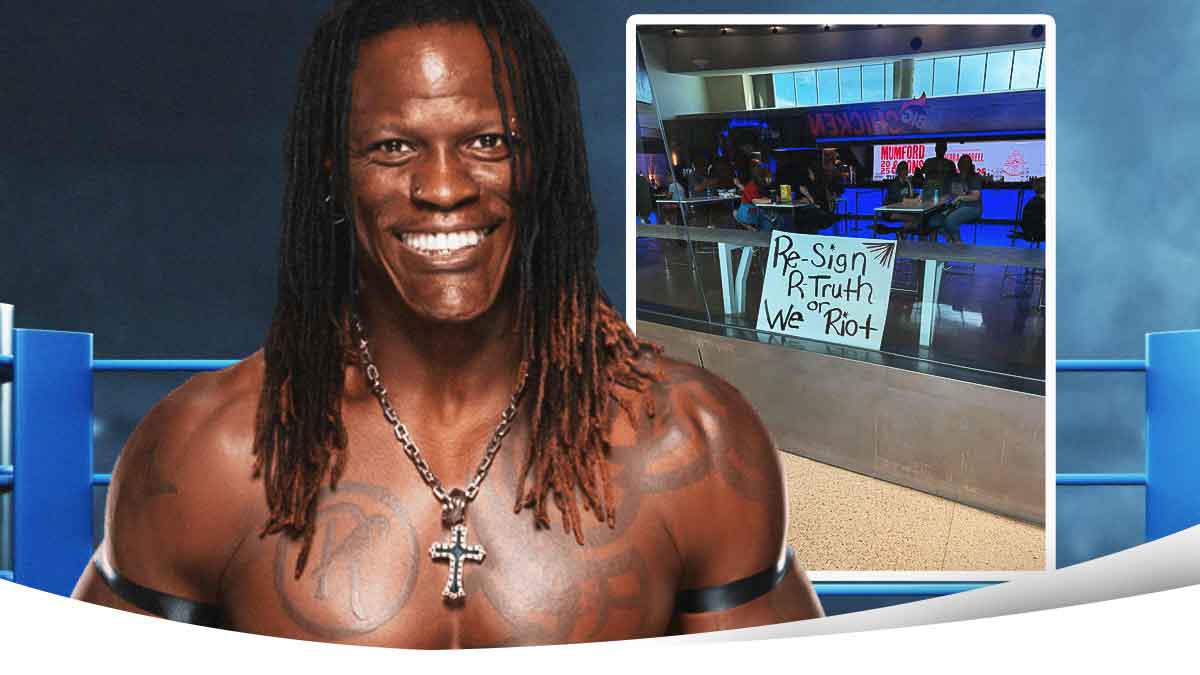 R-Truth next to the attached WWE sign
