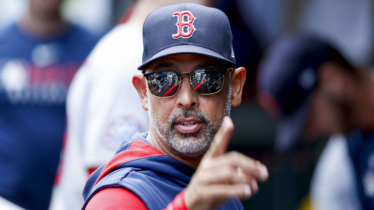 Boston Red Sox manager Alex Cora (13) stands in the dugout following the inning against the Seattle Mariners at T-Mobile Park.