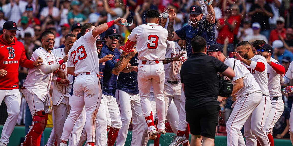 Boston Red Sox outfielder Ceddanne Rafaela (3) is congratulated after hitting a game winning home run against the Los Angeles Angels in the ninth inning at Fenway Park.