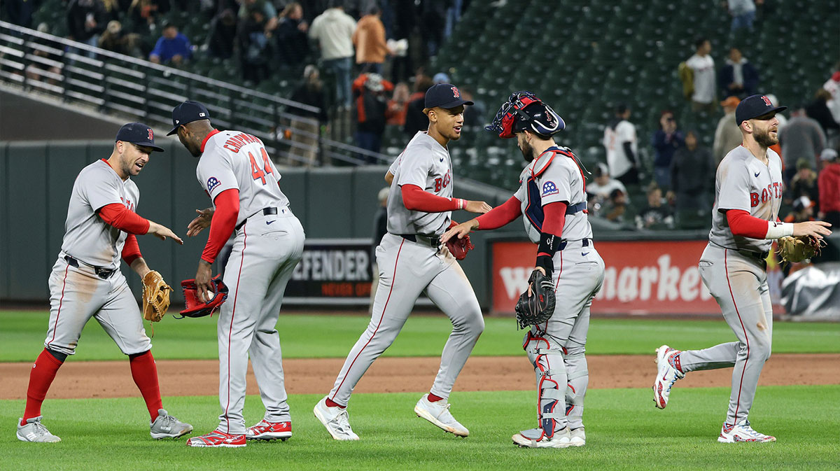 Boston Red Sox players celebrate after defeating the Baltimore Orioles at Oriole Park at Camden Yards.