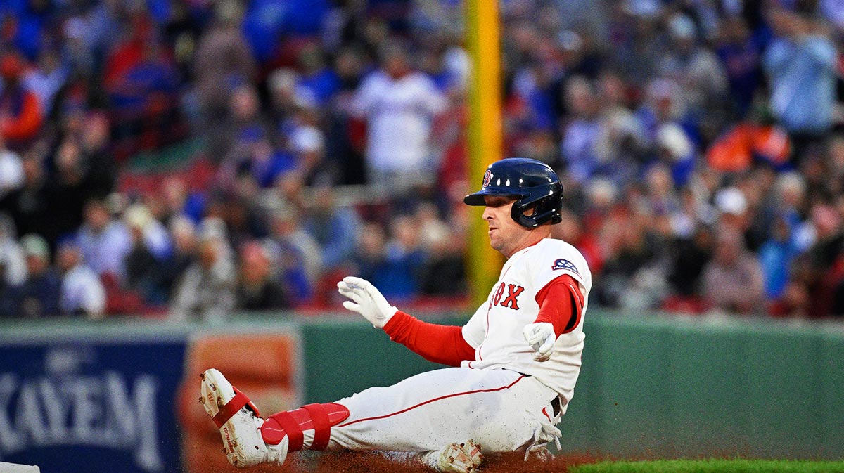 Boston Red Sox third baseman Alex Bregman (2) slides into second base during the third inning against the New York Mets at Fenway Park.