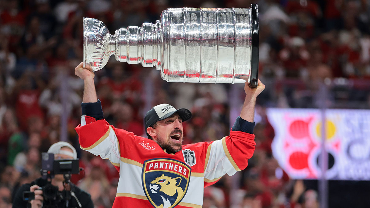 Florida Panthers center Brad Marchand (63) hoists the Stanley Cup after winning game six of the 2025 Stanley Cup Final against the Edmonton Oilers at Amerant Bank Arena. Mandatory
