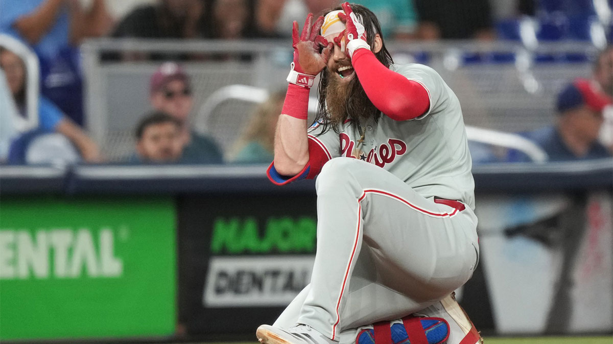 Jun 16, 2025; Miami, Florida, USA; Philadelphia Phillies center fielder Brandon Marsh (16) celebrates triple in the seventh inning against the Miami Marlins at loanDepot Park.