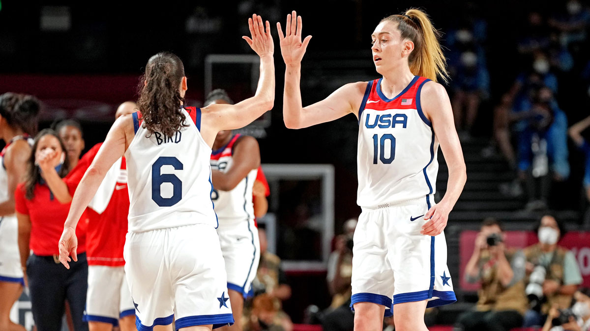 United States guard Sue Bird (6) and United States forward Breanna Stewart (10) celebrate against Japan in the women's basketball gold medal match during the Tokyo 2020 Olympic Summer Games at Saitama Super Arena.