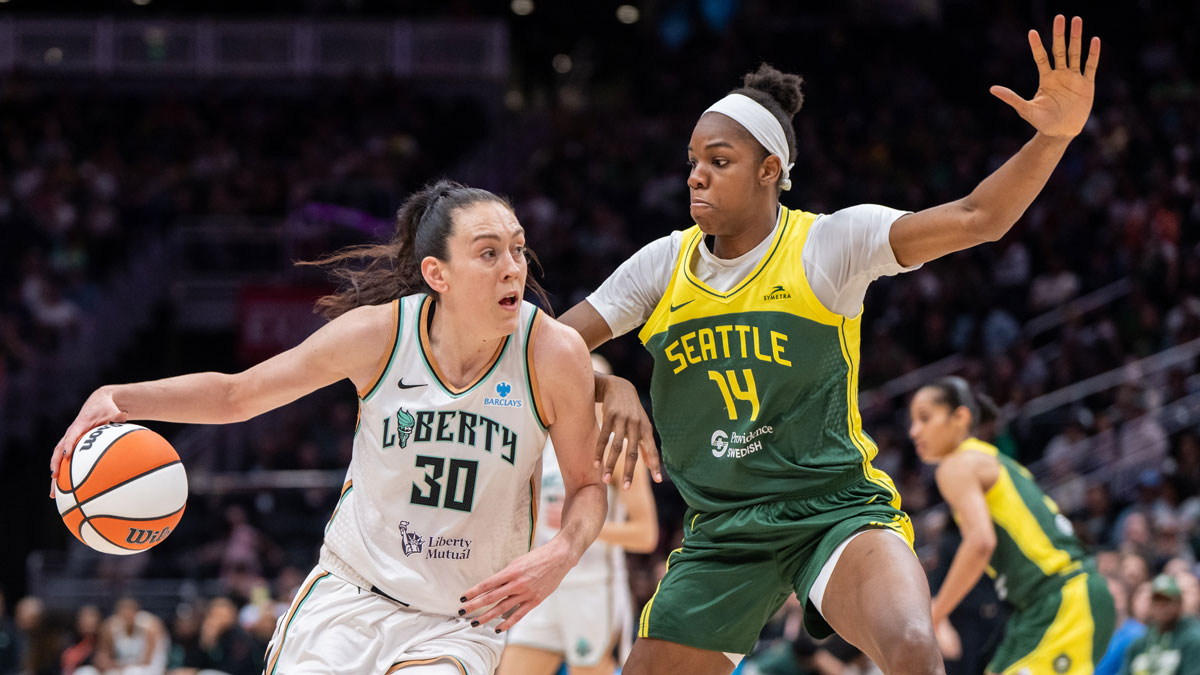 New York Libertyforward Breanna Stewart (30) dribbles the ball against Seattle Storm center Dominique Malonga (14) during the second half at Climate Pledge Arena.