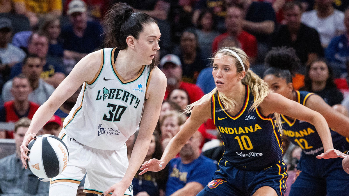 New York Liberty forward Breanna Stewart (30) dribbles the ball while Indiana Fever guard Lexie Hull (10) defends in the first half at Gainbridge Fieldhouse.