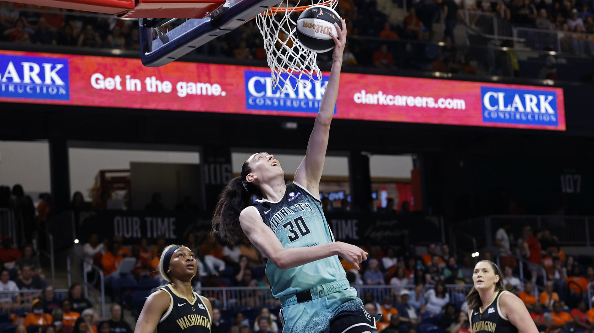 New York Liberty forward Breanna Stewart (30) shoots the ball as Washington Mystics forward Kiki Iriafen (44) looks on in the first half at Entertainment & Sports Arena.