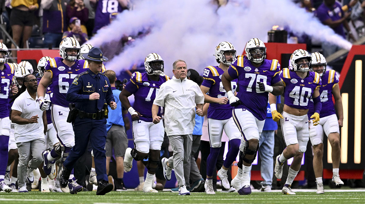 LSU Tigers head coach Brian Kelly enters the field with the team prior to the game against the Baylor Bears at NRG Stadium.
