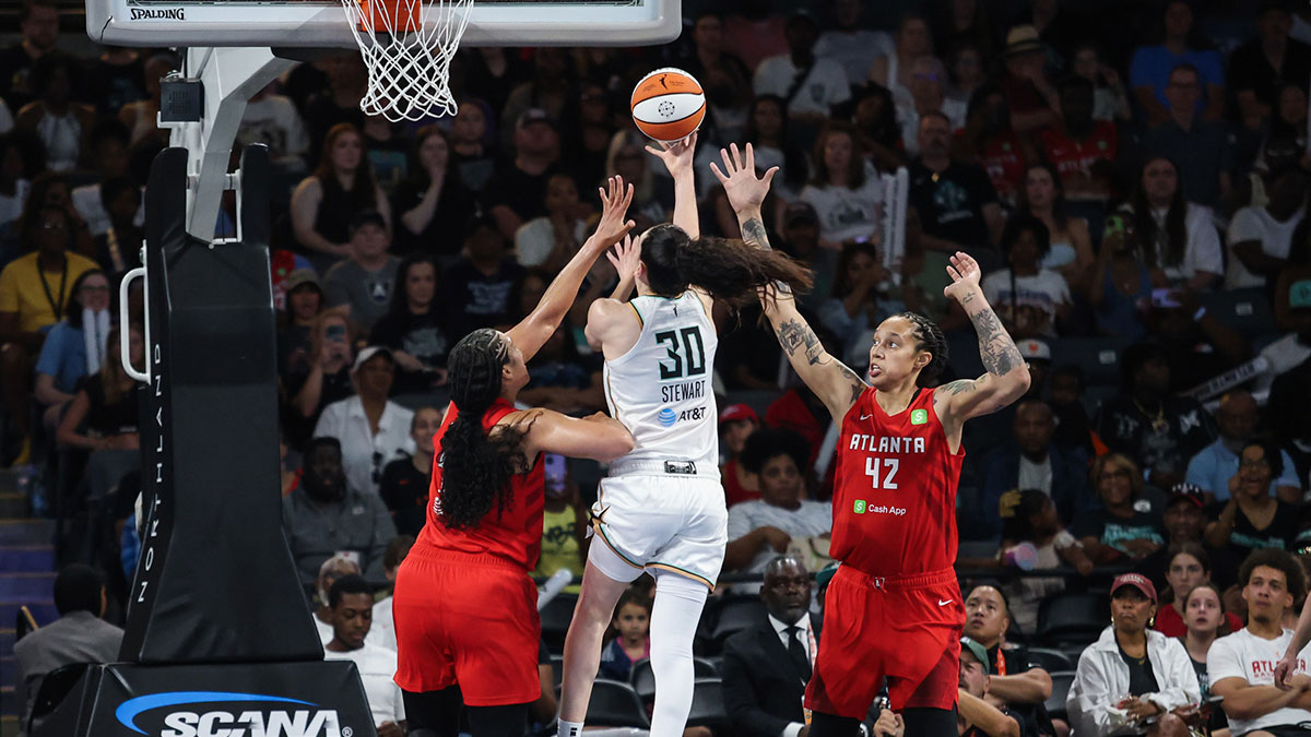 New York Liberty forward Breanna Stewart (30) shoots the ball against Atlanta Dream forward Brionna Jones (24) and Atlanta Dream center Brittney Griner (42) during the first quarter at Gateway Center Arena at College Park.