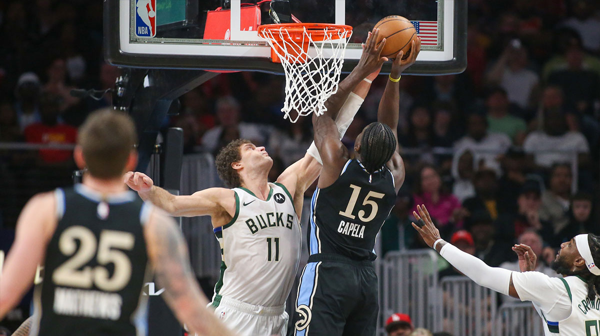 Milwaukee Bucks center Brook Lopez (11) blocks the shot of Atlanta Hawks center Clint Capela (15) in the second quarter at State Farm Arena.