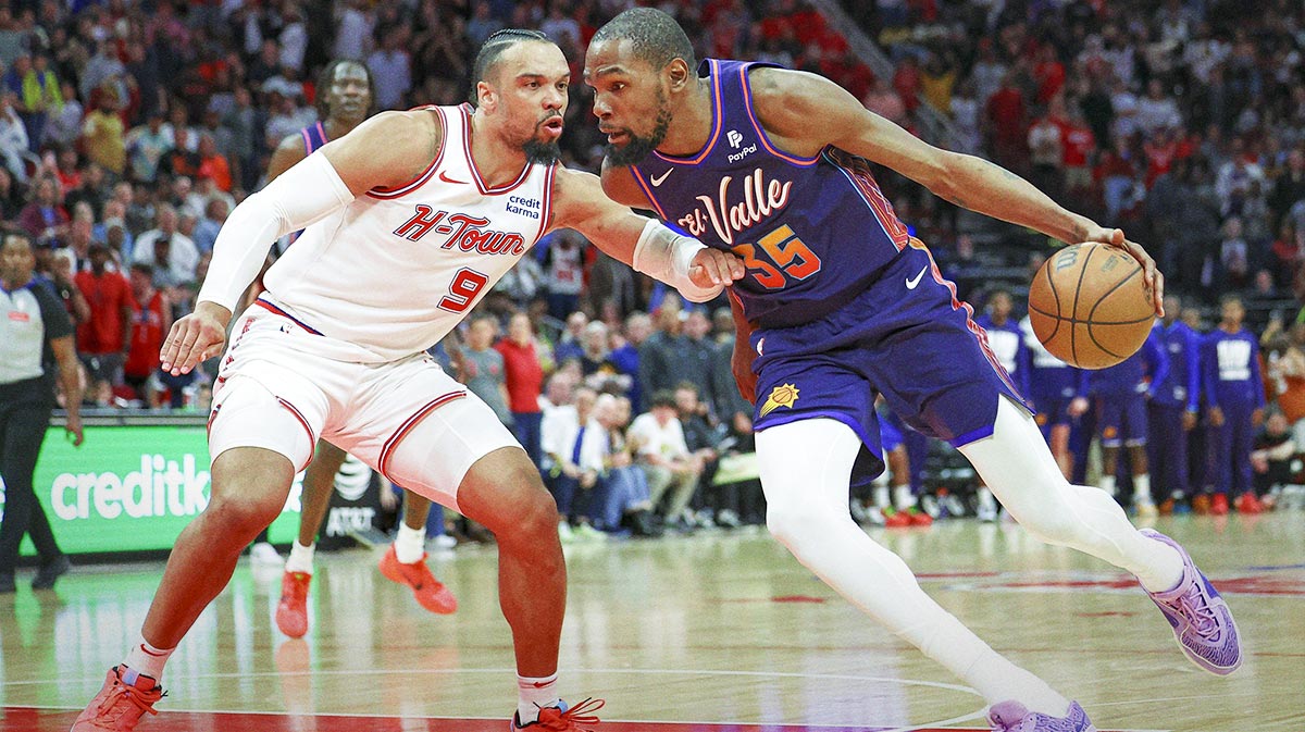Phoenix Suns forward Kevin Durant (35) drives to the basket as Houston Rockets forward Dillon Brooks (9) defends during the fourth quarter at Toyota Center.