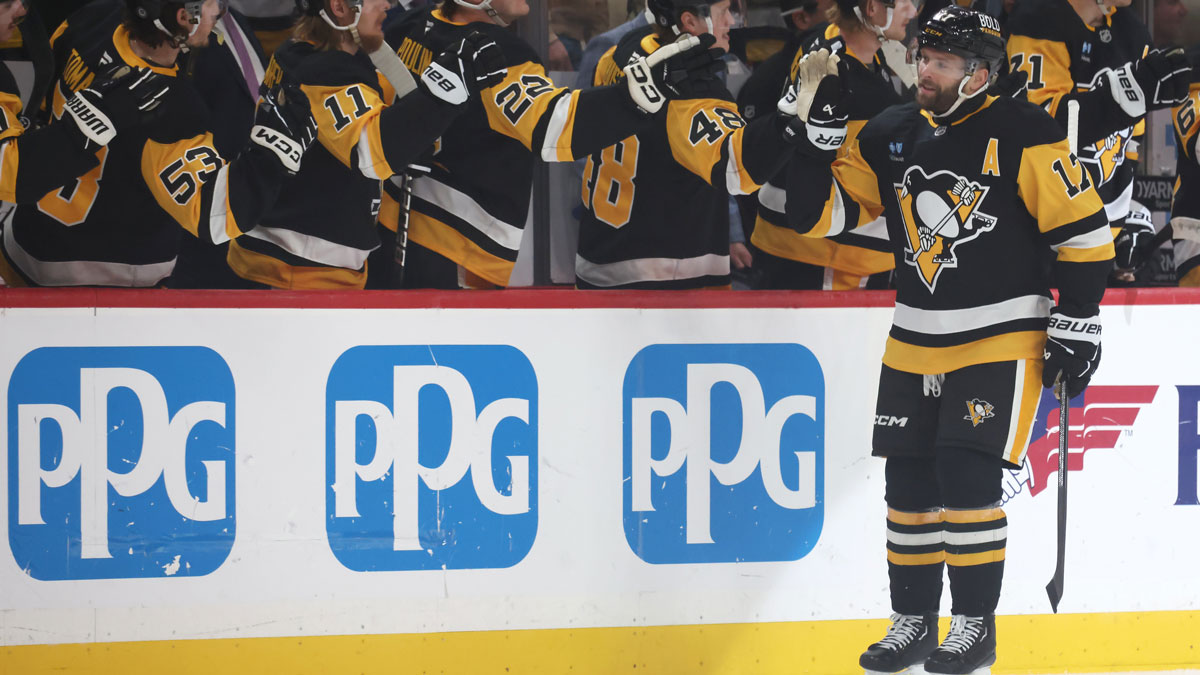Pittsburgh Penguins right wing Bryan Rust (17) celebrates his goal with the Penguins bench against the Washington Capitals during the first period at PPG Paints Arena.