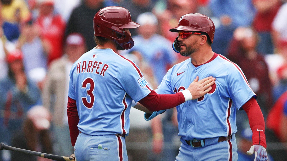 Philadelphia Phillies designated hitter Kyle Schwarber (12) celebrates his home run with first base Bryce Harper (3) during the seventh inning against the Colorado Rockies at Citizens Bank Park.
