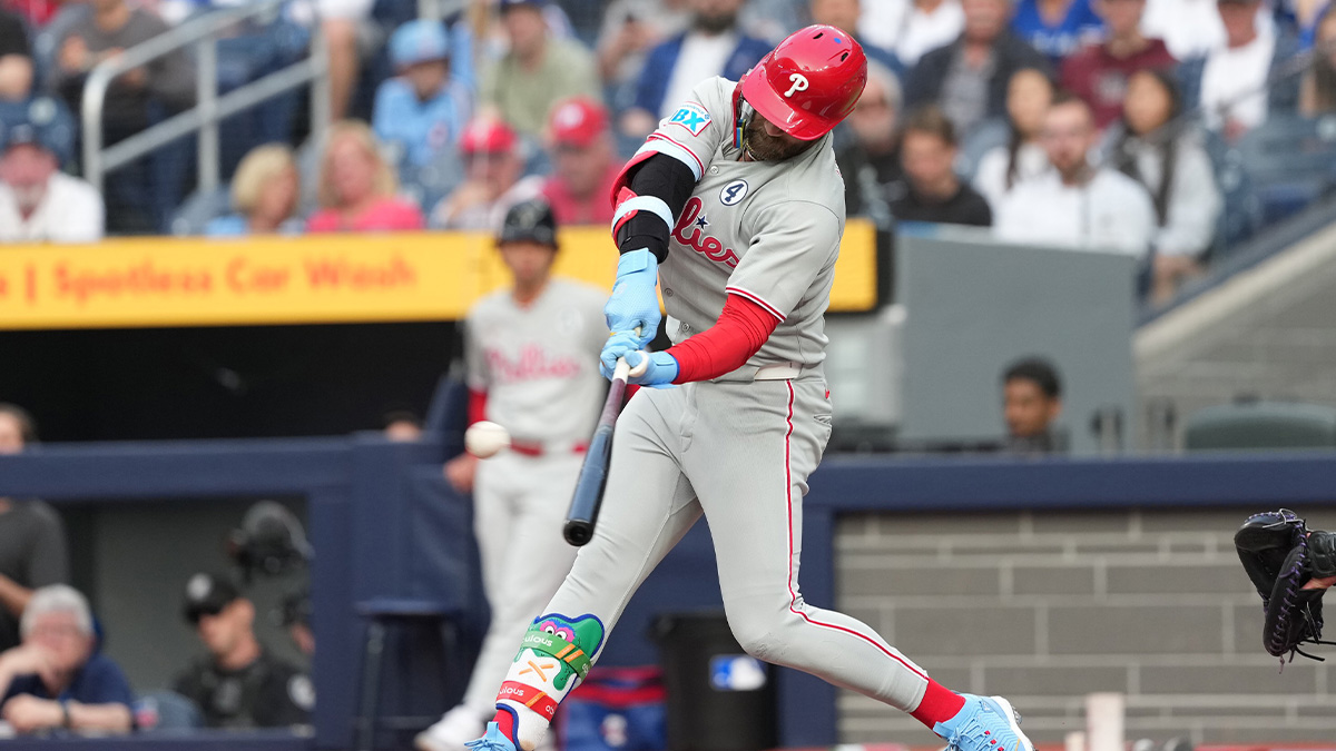 Jun 3, 2025; Toronto, Ontario, CAN; Philadelphia Phillies first baseman Bryce Harper (3) hits a home run against the Toronto Blue Jays during the first inning at Rogers Centre. 