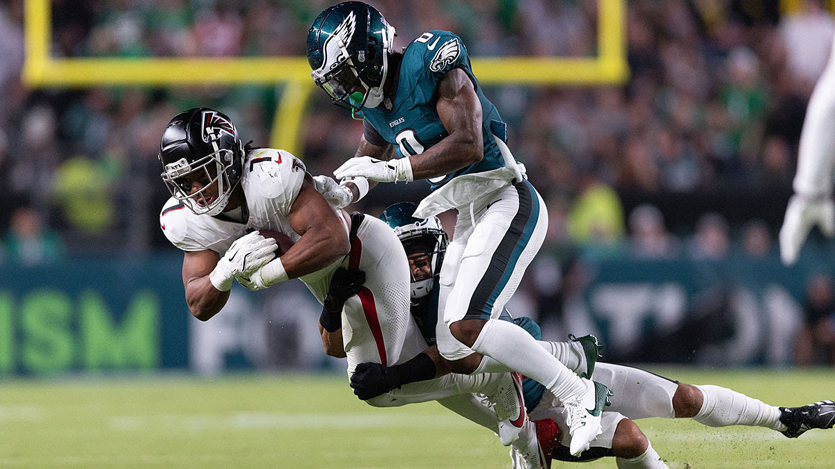 Philadelphia Eagles defensive end Bryce Huff (0) tackles Atlanta Falcons running back Bijan Robinson (7) after a catch during the second quarter.
