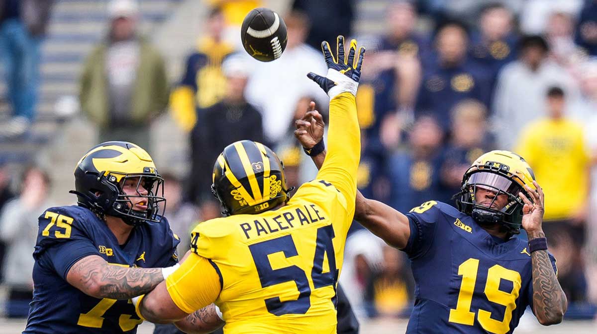 Team Blue quarterback Bryce Underwood (19) makes a pass against Team Maize during the second half of the spring game at Michigan Stadium