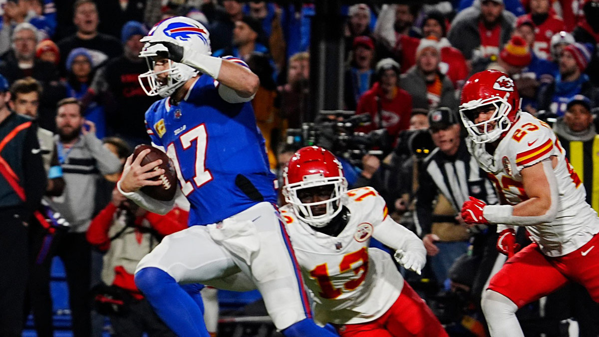 Bills quarterback Josh Allen avoids Kansas City's Nazeeh Johnson and Drue Tranquill on his late fourth quarter touchdown carry into the end zone in Orchard Park, Nov.17, 2024.