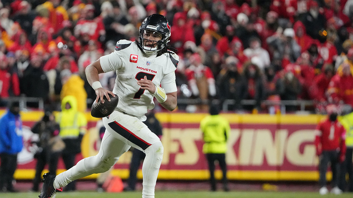 Houston Texans quarterback C.J. Stroud (7) rolls out to throw against the Kansas City Chiefs during the fourth quarter of a 2025 AFC divisional round game at GEHA Field at Arrowhead Stadium.