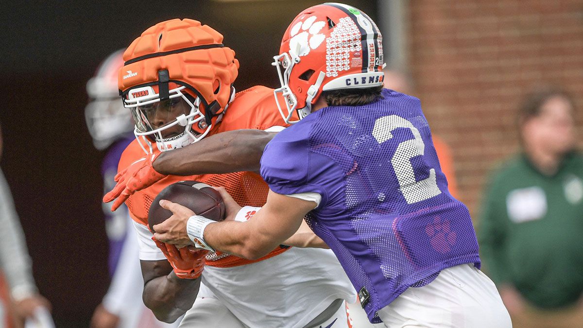Clemson running back Gideon Davidson (9) takes a handoff from quarterback Cade Klubnik (2) during Spring Practice in Clemson, S.C. Monday, March 24, 2025.