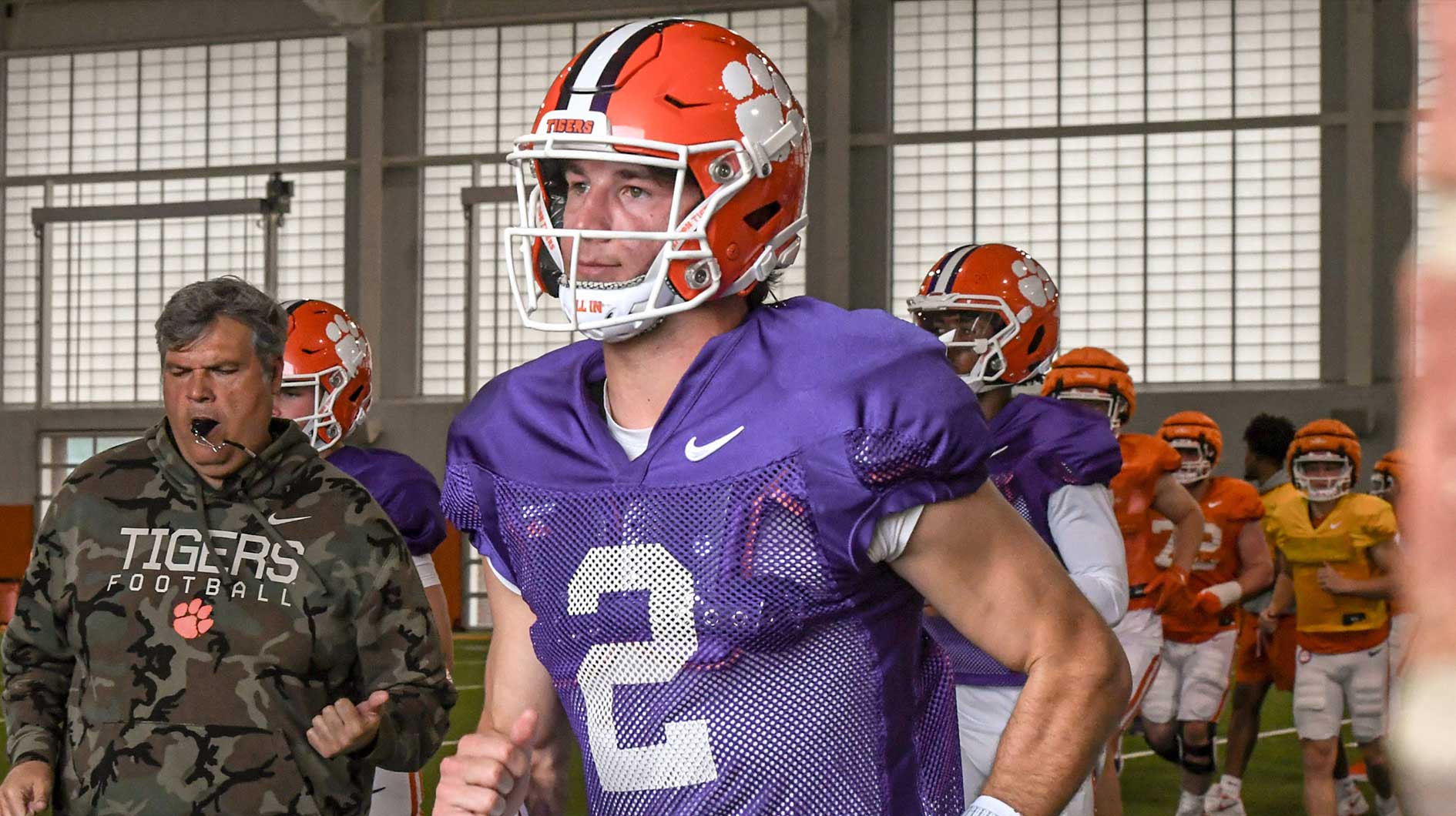 Clemson quarterback Cade Klubnik (2) runs to the outdoor fields with teammates and coaches during Spring Practice in Clemson, S.C. Monday, March 24, 2025.