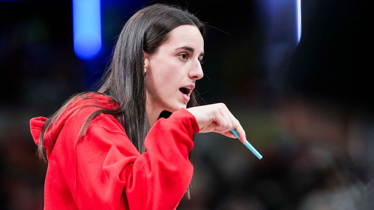 Indiana Fever guard Caitlin Clark (22) talks with an official during a timeout Tuesday, June 3, 2025, at a game between the Indiana Fever and the Washington Mystics