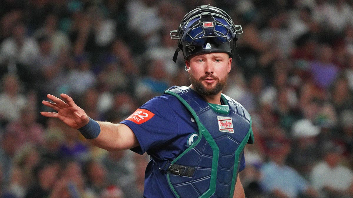 Seattle Mariners catcher Cal Raleigh (29) looks for a sign against the Arizona Diamondbacks in the fifth inning at Chase Field.