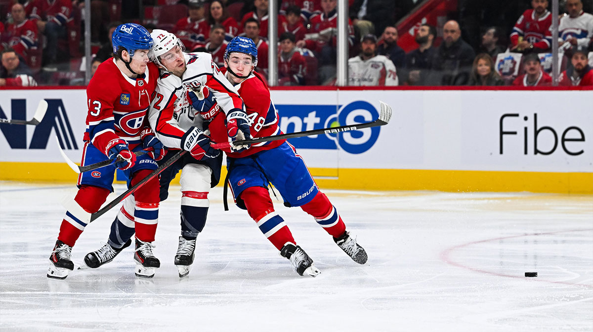 Montreal Canadiens right wing Cole Caufield (13) and defenseman Lane Hutson (48) defend against Washington Capitals left wing Anthony Beauvillier (72) during the second period in game four of the first round of the 2025 Stanley Cup Playoffs at Bell Centre.