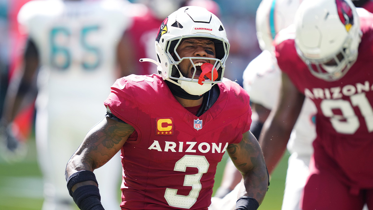 Arizona Cardinals safety Budda Baker (3) celebrates tackling Miami Dolphins wide receiver Jaylen Waddle (17) for a short gain in the third quarter at Hard Rock Stadium.