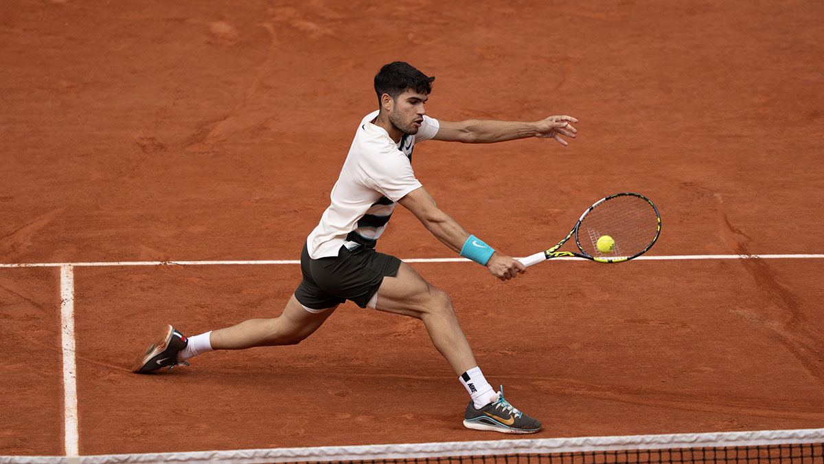 Carlos Alcaraz of Spain returns a shot during the menís singles final against Jannik Sinner of Italy5on day 15 at Roland Garros Stadium.
