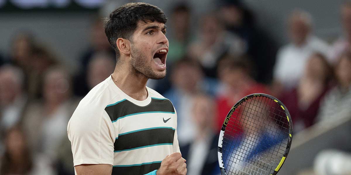 Carlos Alcaraz of Spain reacts to a point during his match against Lorenzo Musetti of Italy match on day 13 at Roland Garros Stadium.