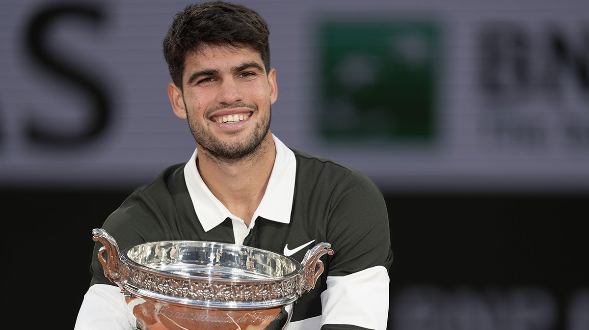 Carlos Alcaraz of Spain poses with the trophy after winning the men’s singles final against Jannik Sinner of Italy on day 15 at Roland Garros Stadium.
